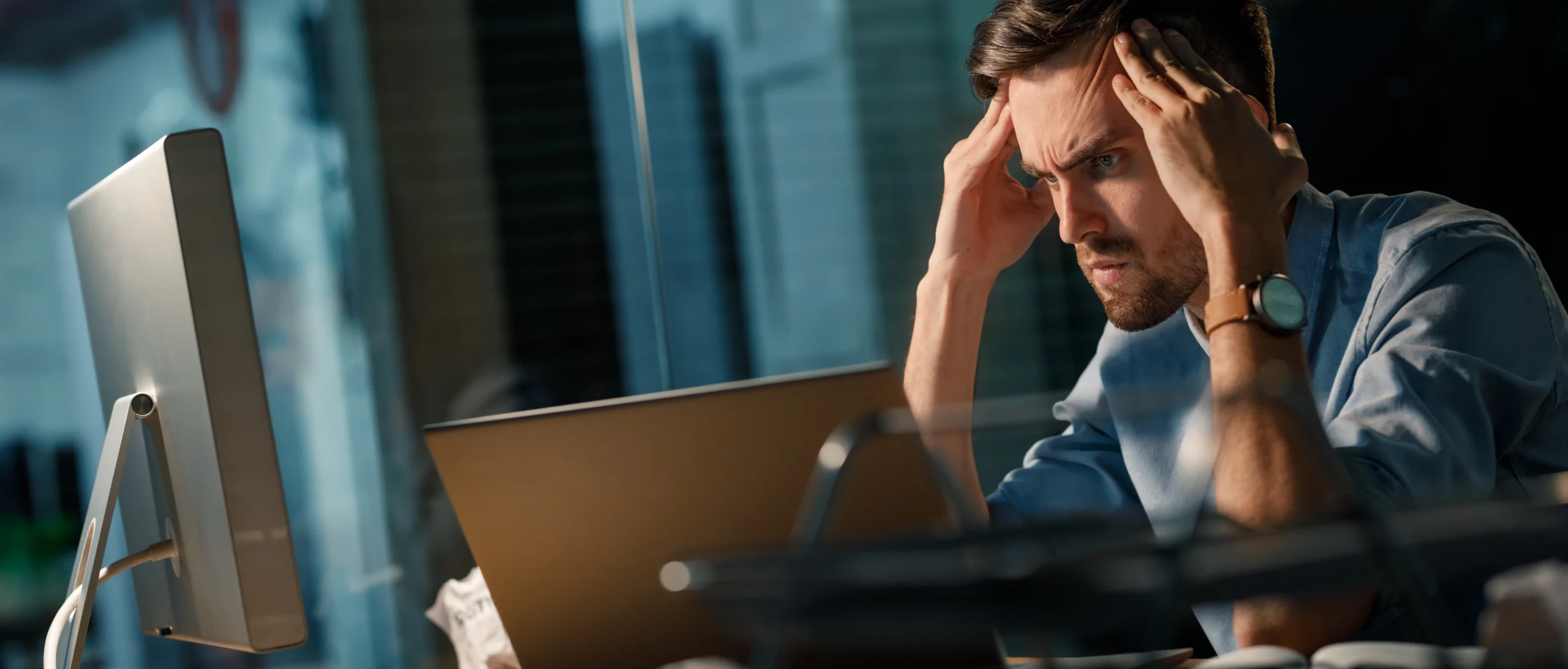 capacity planning data center outages done by man with laptop